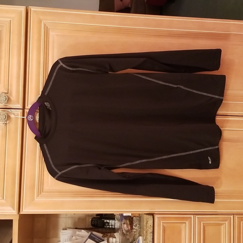 Like new New Balance Dry Fit Athketic shirt.